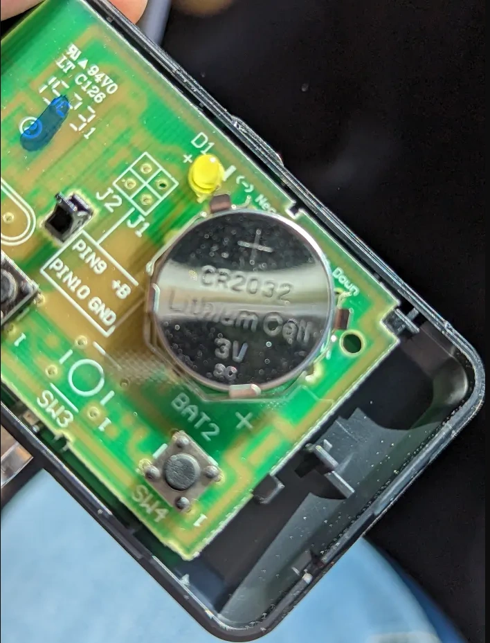 Inside of Chamberlain remote showing CR2032 battery on circuit board